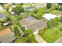 Aerial view of house with pool and surrounding neighborhood at 2406 W Orange Blvd, Kissimmee, FL 34741