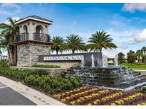 Impressive entrance to Isles of Lake Nona with fountain and signage at 14315 Sapelo Beach Dr, Orlando, FL 32827