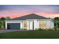 Single-story home with a two-car garage and landscaped yard at 11350 Rising Sun St, Orlando, FL 32829