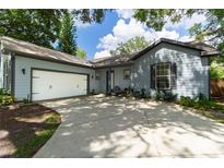 Newly renovated light blue house with a two car garage at 5525 Barma St, Orlando, FL 32807