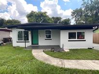 Newly renovated home with green front door at 612 W Miller St, Orlando, FL 32805