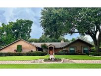 Brick ranch house with mature landscaping at 3336 Edgecliffe Dr, Orlando, FL 32806