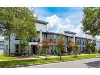 Modern townhouses with attractive landscaping and balconies at 2120 Broome St, Kissimmee, FL 34743