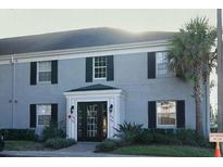 Brick building with multiple units and a well-maintained entrance at 301 Lewfield Cir, Winter Park, FL 32792