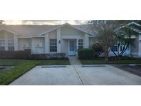 Inviting exterior of townhome with landscaping at 7794 Country Pl # 7794, Winter Park, FL 32792