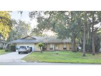 Single-story house with a two-car garage and front yard at 4013 Quenita Dr, Winter Park, FL 32792