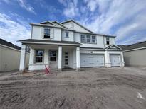 Two story home with white siding and three car garage at 5237 Prairie Preserve Run, Saint Cloud, FL 34772