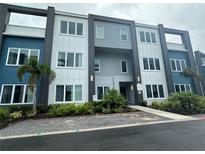 Modern two-story building exterior with stylish facade at 7740 Sandy Ridge Dr # 135, Kissimmee, FL 34747