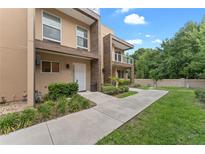 Modern townhome exterior with a landscaped walkway at 3175 Brasilia Ave, Kissimmee, FL 34747