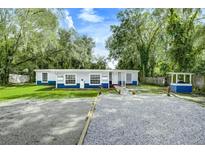 Cute blue house with a spacious yard at 313 Story Partin Rd, Orlando, FL 32833