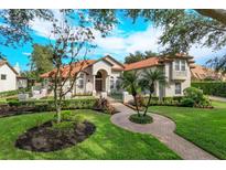 Beautiful two-story house with a manicured lawn at 11227 Macaw Ct, Windermere, FL 34786