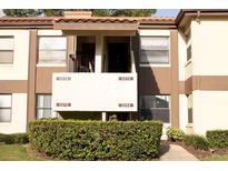 Exterior view of a two-story building with multiple units at 3276 Candle Ridge Ct # 202, Orlando, FL 32822