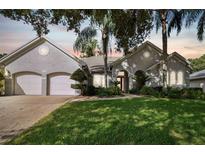 Two-story house with double garage and manicured lawn at 372 Hinsdale Dr, Debary, FL 32713