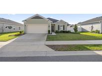 Charming one-story house with a two-car garage, and landscaped lawn at 7358 Sw 76Th Ter, Ocala, FL 34481