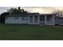 A simple, ranch-style home with a covered porch at 1106 N Hoagland Blvd, Kissimmee, FL 34741