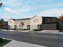 Three-unit townhome building with two-car garages at 16380 Happy Eagle Dr, Clermont, FL 34714