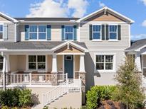 Two-story home with front porch and landscaping at 1366 Tarflower Dr, Winter Springs, FL 32708