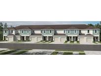 Modern townhouses with attached garages and attractive landscaping at 2783 Puffin Pl, Davenport, FL 33837