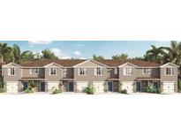 Five-unit townhome building with neutral gray siding and two-car garages at 2910 Hudson Hammock Way, Saint Cloud, FL 34773