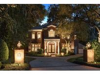 Elegant two-story brick home with a landscaped yard at 1391 Richmond Rd, Winter Park, FL 32789