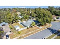 Aerial view of single-story house with large backyard and detached shed at 107 Hickory Tree Rd, Longwood, FL 32750