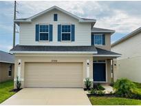 Two story house with beige and blue exterior at 3726 Sagefield Dr, Saint Cloud, FL 34773