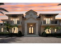 Stunning two-story home with a grand entrance and meticulously landscaped grounds at 5174 Vardon Dr, Windermere, FL 34786