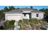 New construction home with block exterior and two-car garage at 619 Alafia Pl, Poinciana, FL 34759