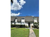 Condo building exterior with grassy lawn at 1944 Conway Rd # 6, Orlando, FL 32812