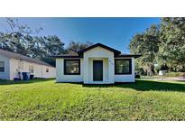 Newly renovated single story home with a well-manicured lawn at 612 W Beresford Ave, Deland, FL 32720