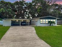 Mid-century modern home with a two-car carport at 518 Oranole Rd, Maitland, FL 32751