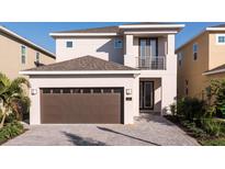 Two-story home with a brown garage door at 7554 Marker Ave, Kissimmee, FL 34747