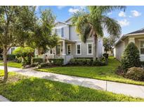 Two-story house with inviting front porch at 14650 Bahama Swallow Blvd, Winter Garden, FL 34787