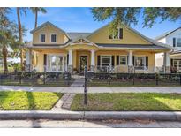 Two-story craftsman style home with front porch and landscaping at 8136 Key West Dove St, Winter Garden, FL 34787