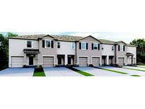 Modern townhouses with attached garages at 2204 Tongass Bnd, Davenport, FL 33837