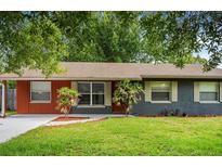 Ranch-style home with gray siding and orange accents at 2706 8Th St, Saint Cloud, FL 34769