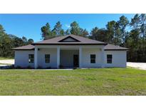 Charming one-story home with covered porch at 13356 Sw 64Th Street Rd, Ocala, FL 34482