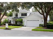 Two story home with a two car garage and manicured lawn at 1379 Hampstead Ter, Oviedo, FL 32765