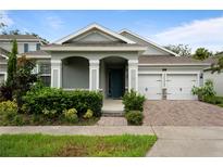 Two-story home with two-car garage and landscaping at 890 Terrapin Dr, Debary, FL 32713
