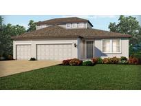 Two-story home with three car garage and attractive landscaping at 2125 Divot Dr, Daytona Beach, FL 32124