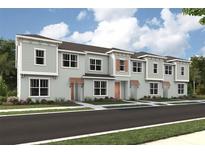 Modern townhome community with light gray exteriors and orange accents at 2308 Zaballina Pl, Kissimmee, FL 34747