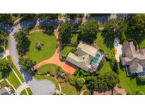 Bird's eye view of house, pool, and landscaped yard at 2128 Lake Crescent Ct, Windermere, FL 34786