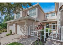 Two-story townhome with attached garage and gated entry at 8362 Bella Tierra Ct, Davenport, FL 33896