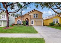 Two story house with front yard and driveway at 17833 Woodcrest Way, Clermont, FL 34714