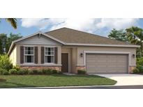 One-story home with gray siding, brown accents, and a two-car garage at 5945 Cliffbow Loop, Leesburg, FL 34748