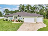 Single-story home with two-car garage and landscaped yard at 19601 Lansdowne St, Orlando, FL 32833