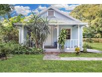 Charming light blue bungalow with a covered porch at 5080 Seminole Ave, Winter Park, FL 32792