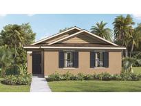 One-story home with tan siding and dark gray roof at 1664 Hummingbird Rd, Winter Haven, FL 33884