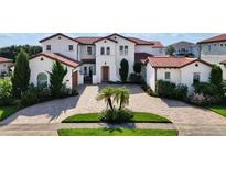 Mediterranean style home with tile roof and driveway at 15716 Panther Lake Dr, Winter Garden, FL 34787