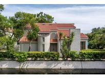 Mediterranean-style home with tile roof, nestled by a canal at 1000 Winderley Pl # 7, Maitland, FL 32751